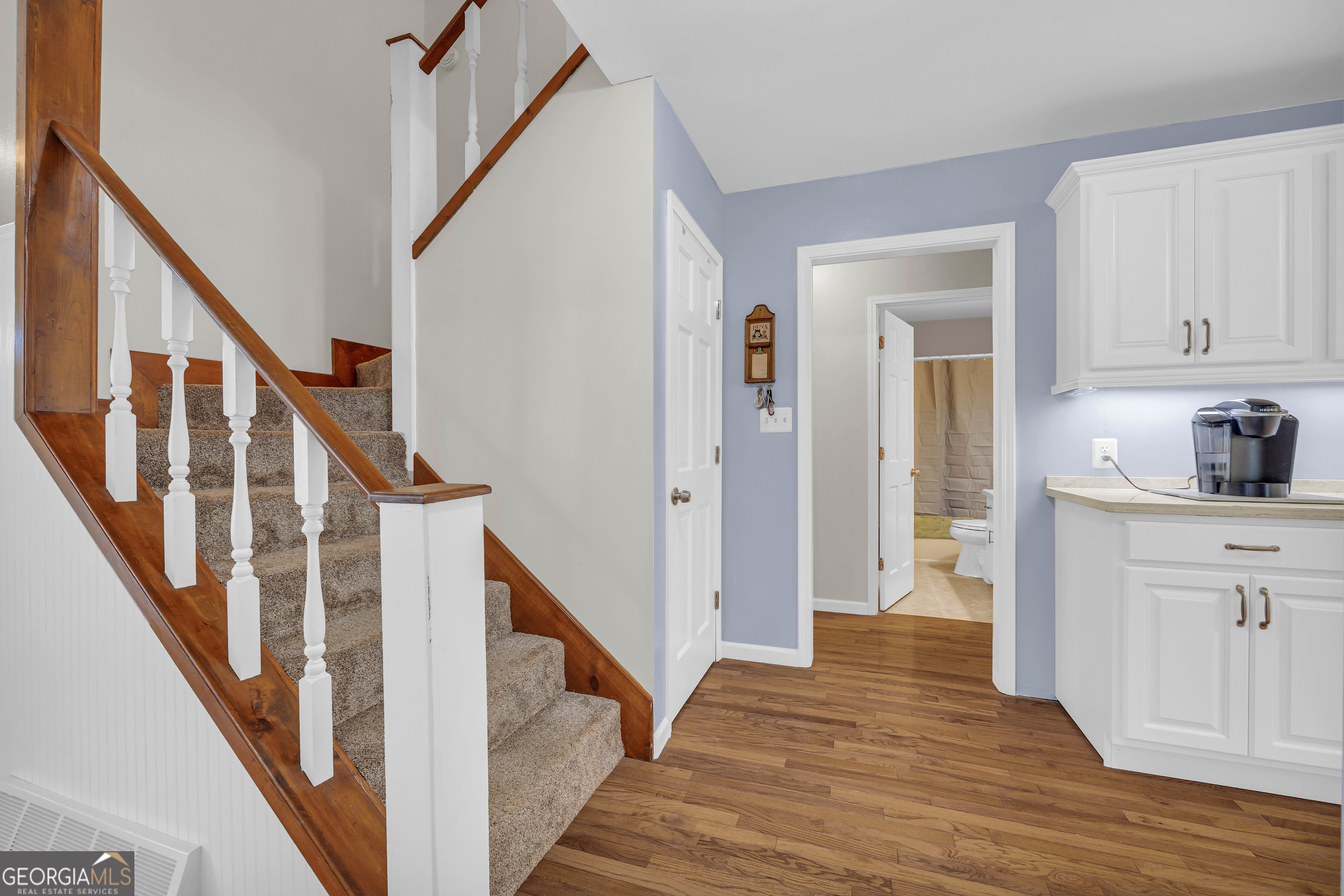 97 Estatohe Circle Toccoa, GA 30577 - Photo 23 of 54 a view of a hallway with wooden floor and staircase