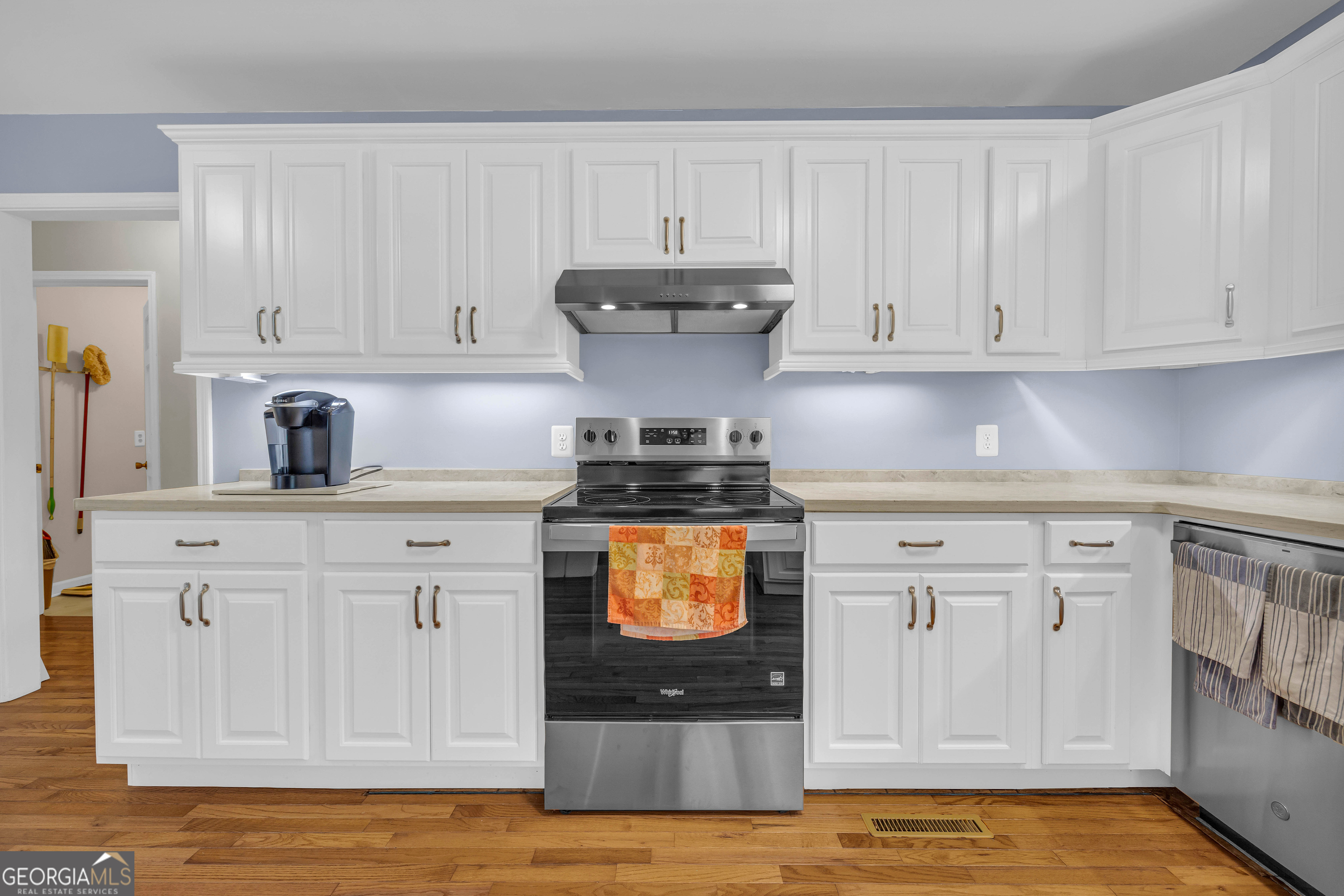 97 Estatohe Circle Toccoa, GA 30577 - Photo 25 of 54 a kitchen with stainless steel appliances granite countertop a stove a sink and white cabinets