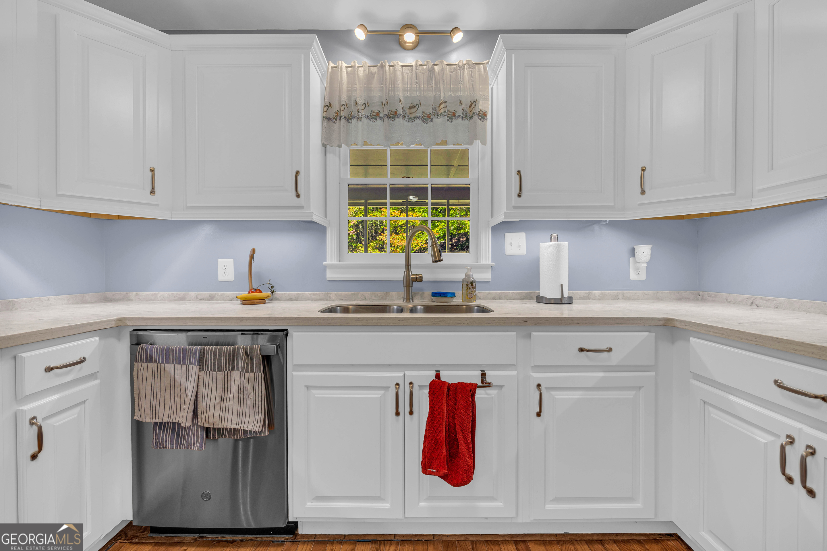 97 Estatohe Circle Toccoa, GA 30577 - Photo 26 of 54 a kitchen with stainless steel appliances granite countertop a sink window and cabinets