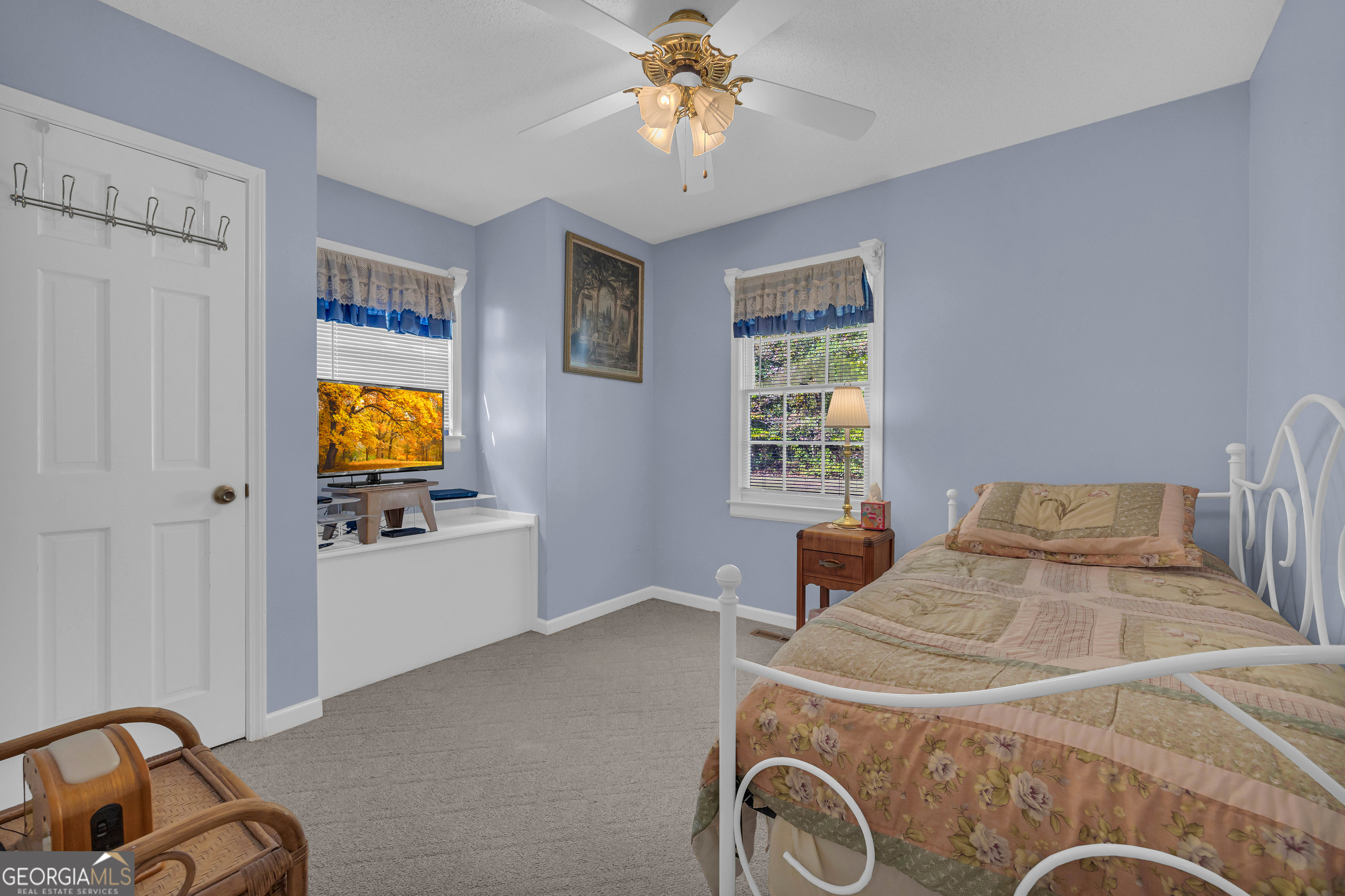 97 Estatohe Circle Toccoa, GA 30577 - Photo 37 of 54 a bedroom with a bed and a chandelier