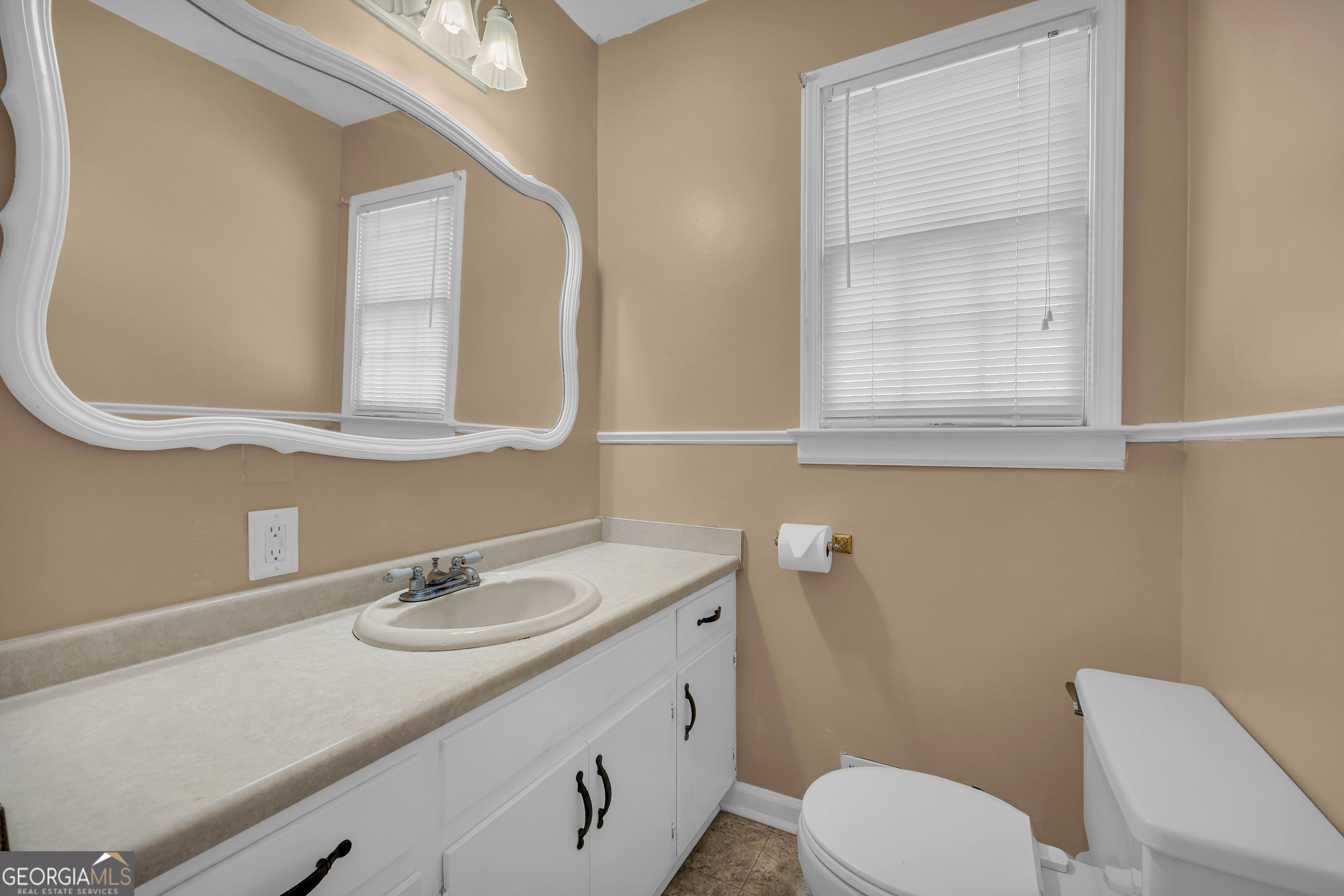 97 Estatohe Circle Toccoa, GA 30577 - Photo 45 of 54 a bathroom with a toilet sink and mirror