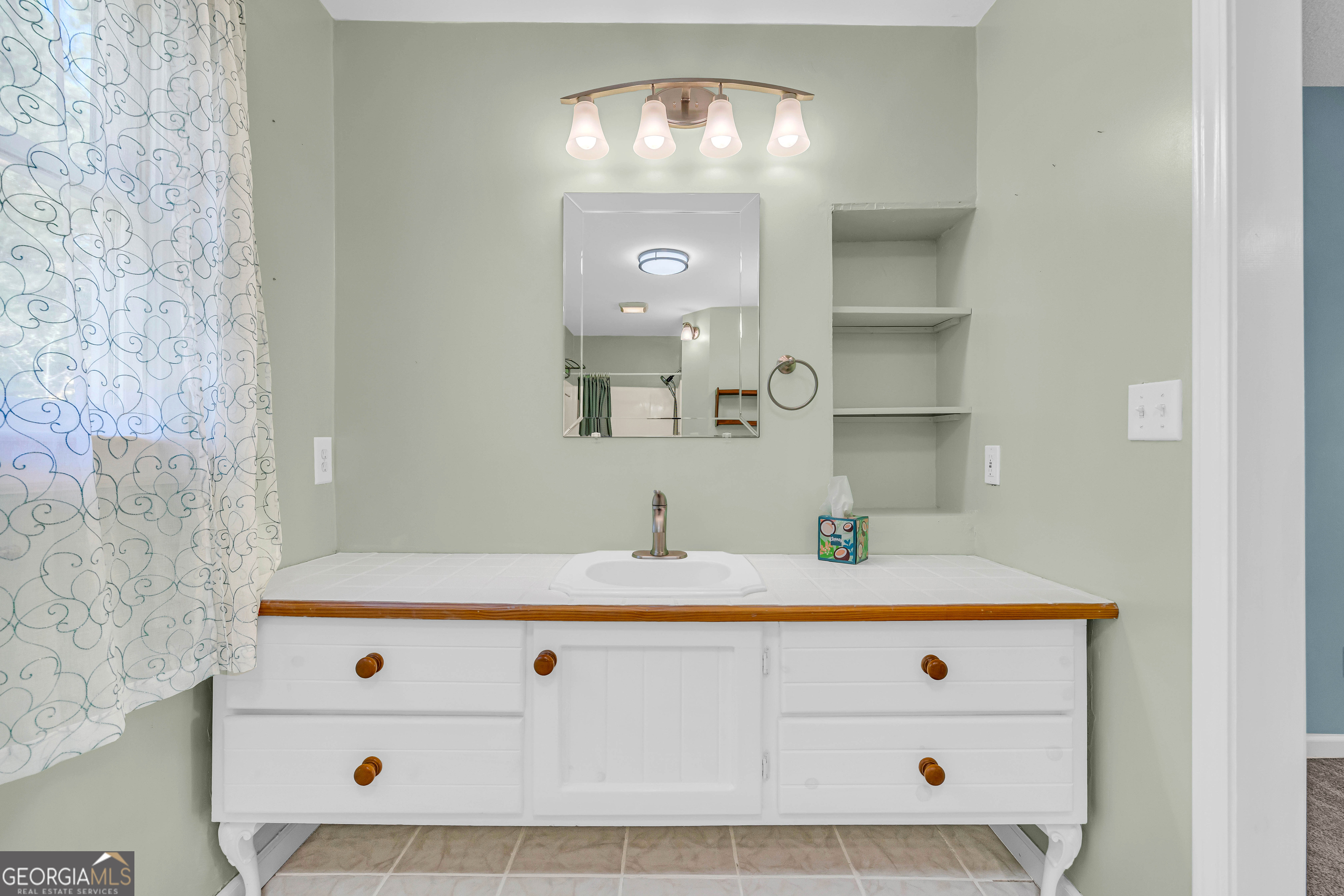 97 Estatohe Circle Toccoa, GA 30577 - Photo 49 of 54 a bathroom with a sink and a mirror