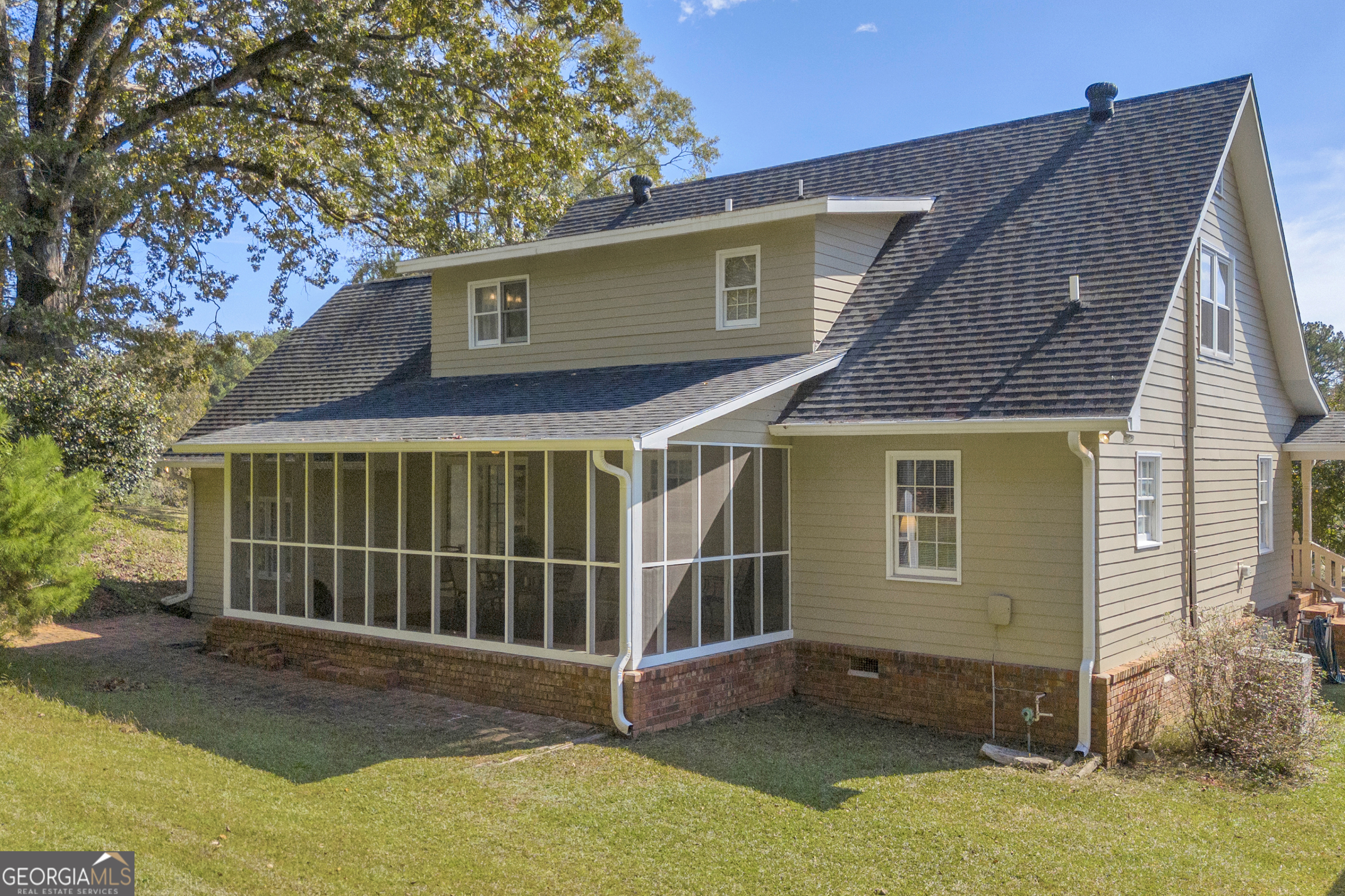 97 Estatohe Circle Toccoa, GA 30577 - Photo 9 of 54 a view of a house with a small yard and wooden fence