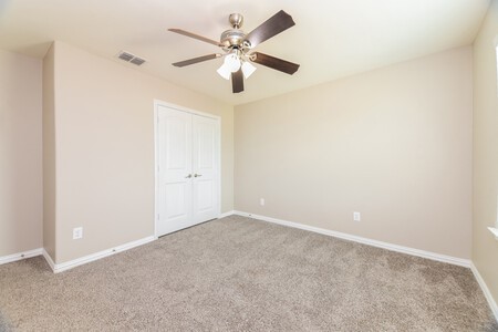 313 Caladium Drive Forney, TX 75126 - Photo 9 of 9 an empty room with a window and a fan