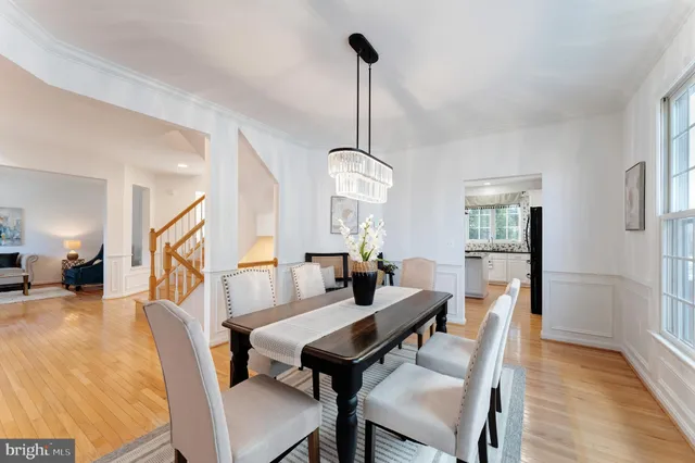 a living room with furniture rug and wooden floor