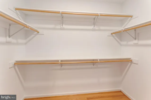 a large spacious bathroom with a double vanity sink a mirror and a bathtub