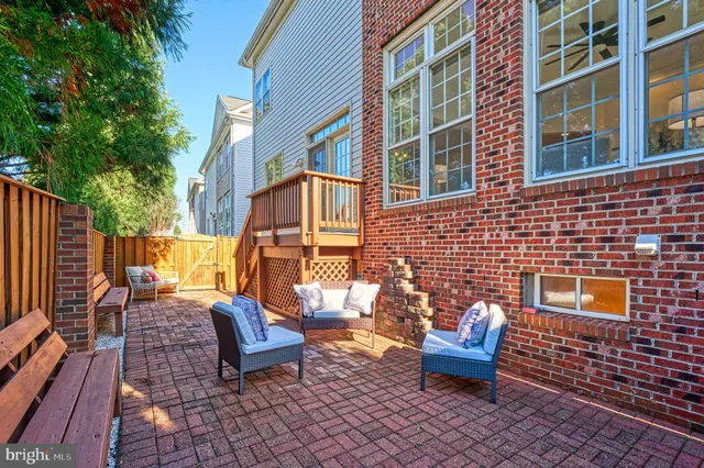 an aerial view of multiple houses with a yard