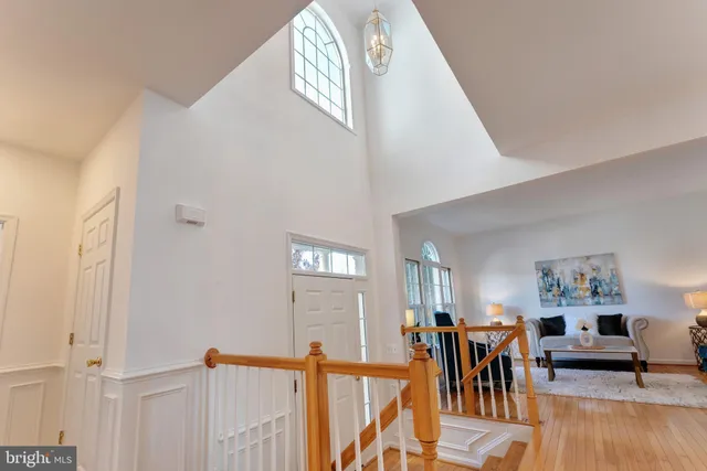 a view of a livingroom with furniture and hardwood floor