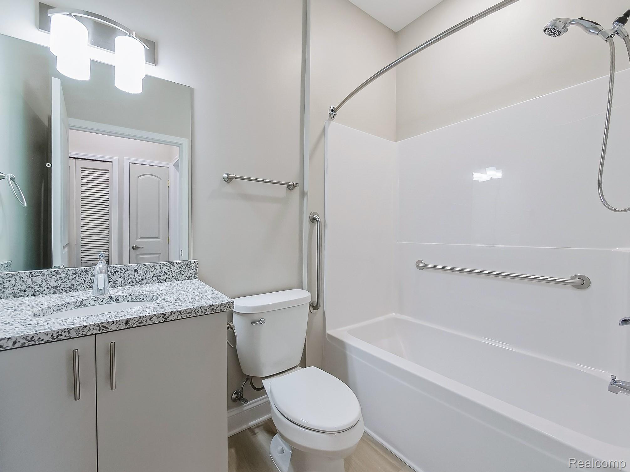 31480 Warren Road, Unit 101 Westland, MI 48185 - Photo 9 of 26 Bathroom with vanity and shower / bathtub combination