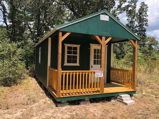 3543 County Road 3543 Saltillo, TX 75478 - Photo 3 of 13 Cabin with AC, chemical toilet and generator.
