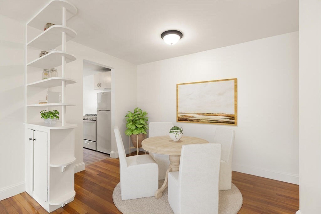 4 Menotomy Road, Unit 5 Arlington, MA 02476 - Photo 8 of 13 a living room with furniture and a potted plant