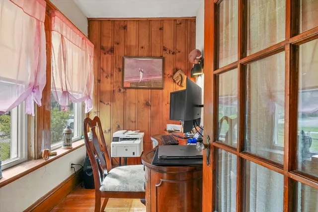 a view of two chairs in the balcony