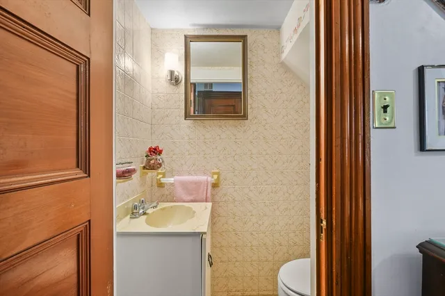 a bedroom with furniture and baby crib