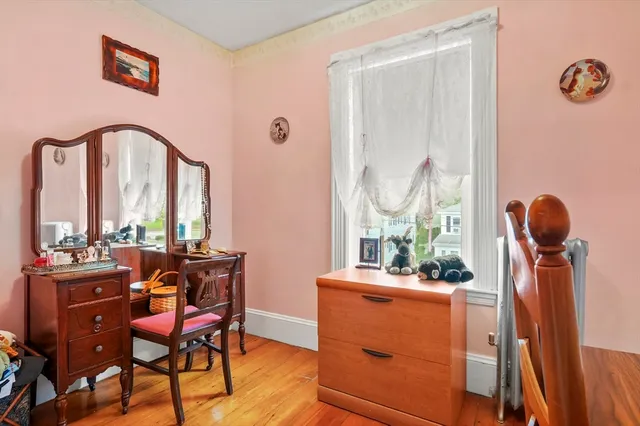 a view of a dining room with furniture and wooden floor