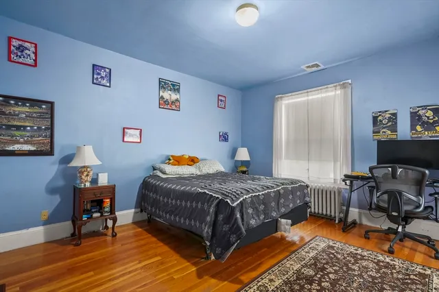 a bedroom with furniture and a window
