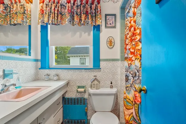 a view of a house with a yard plants and a patio