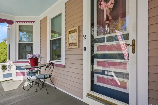 a view of a room with a table and chairs