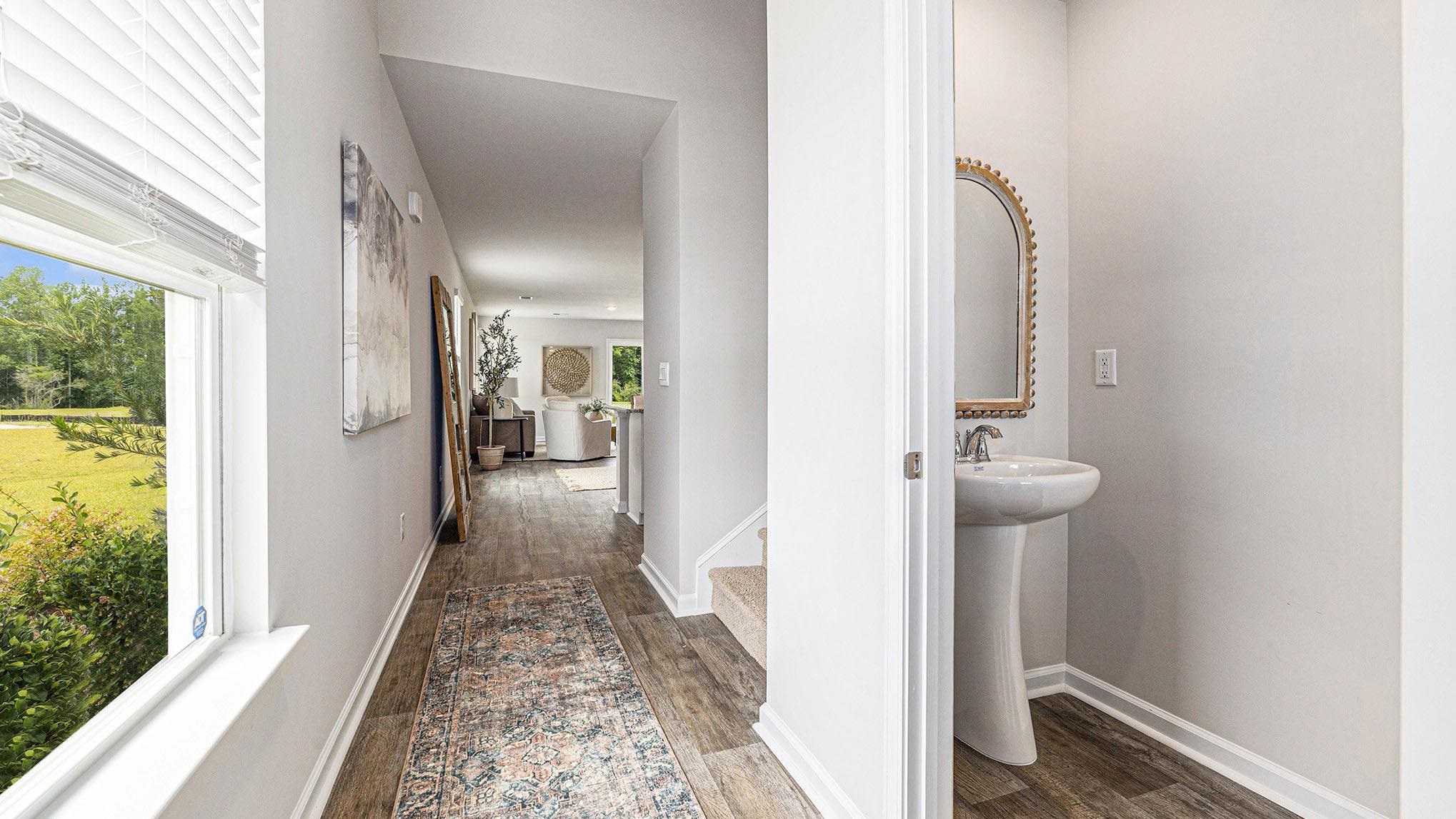 242 Bald Cypress Way Conway, SC 29526 - Photo 12 of 23 Hallway featuring baseboards and dark wood-type flooring