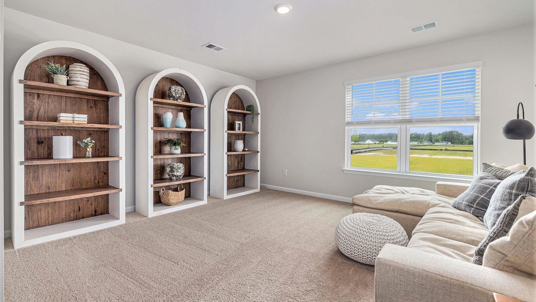 242 Bald Cypress Way Conway, SC 29526 - Photo 17 of 23 Living area with light carpet, built in features, and recessed lighting