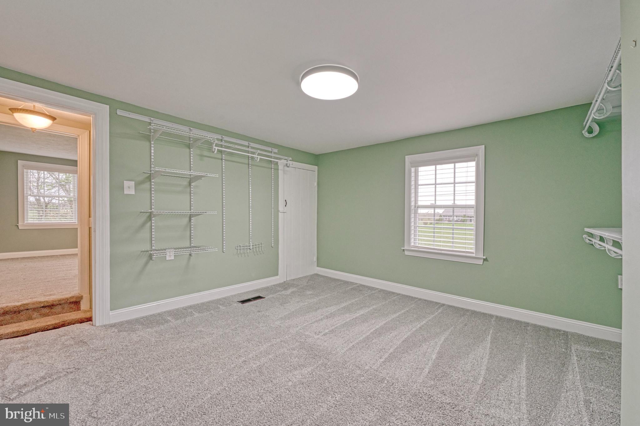 1080 Russell Road Berryville, VA 22611 - Photo 16 of 31 an empty room with windows and closet