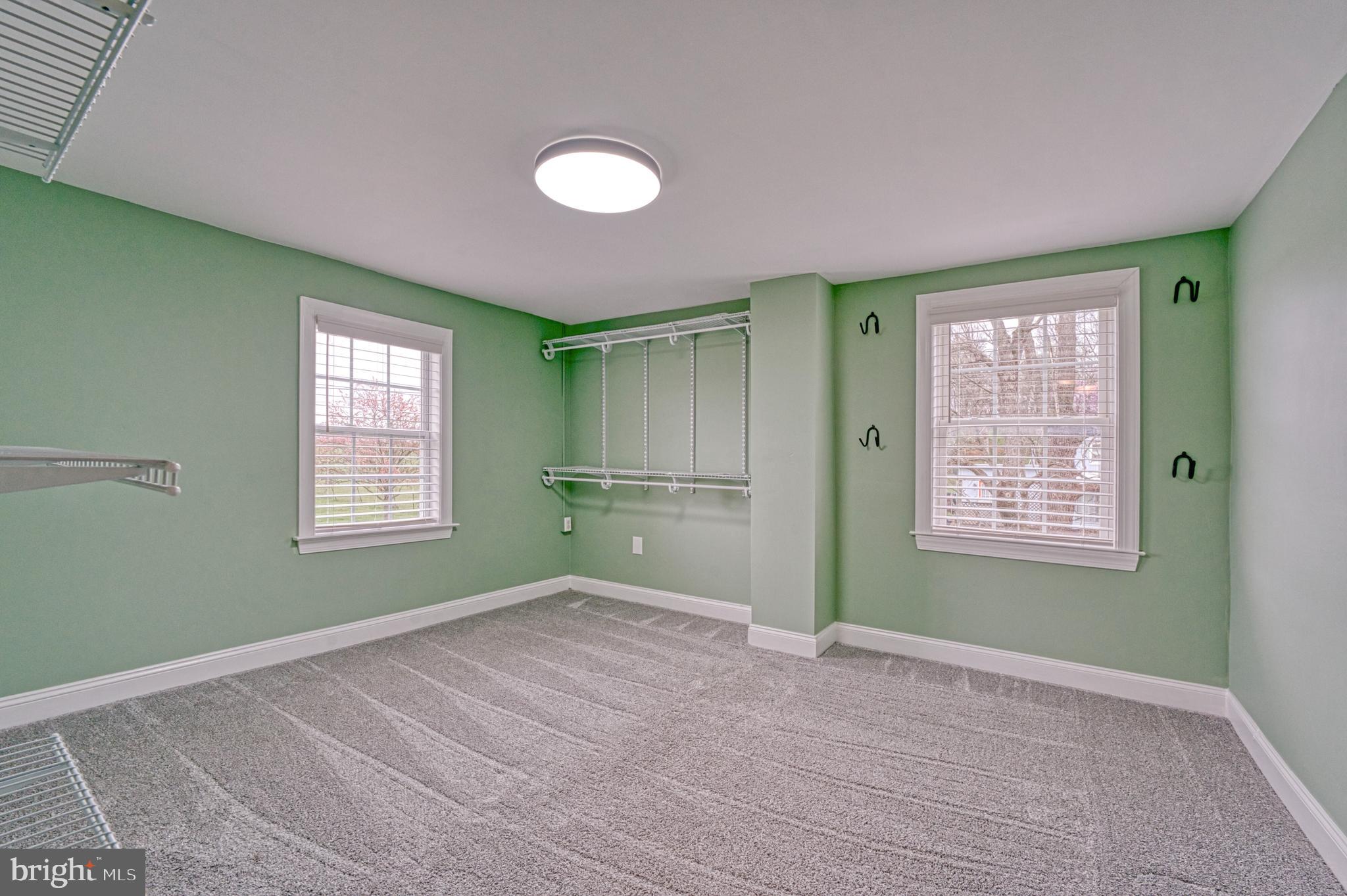 1080 Russell Road Berryville, VA 22611 - Photo 17 of 31 a view of an empty room with a window and a kitchen