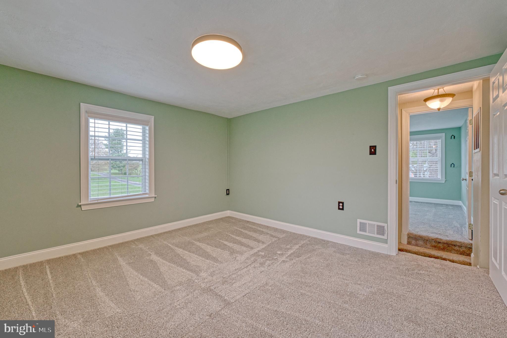 1080 Russell Road Berryville, VA 22611 - Photo 19 of 31 a view of an empty room with window and closet area