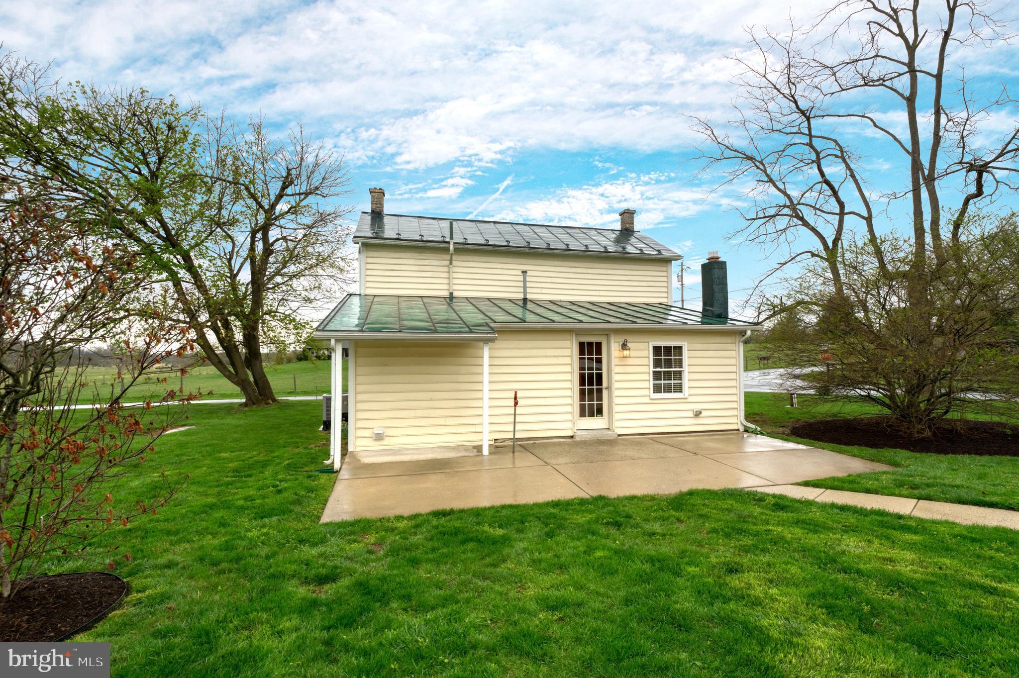 1080 Russell Road Berryville, VA 22611 - Photo 20 of 31 a front view of a house with a yard and garage