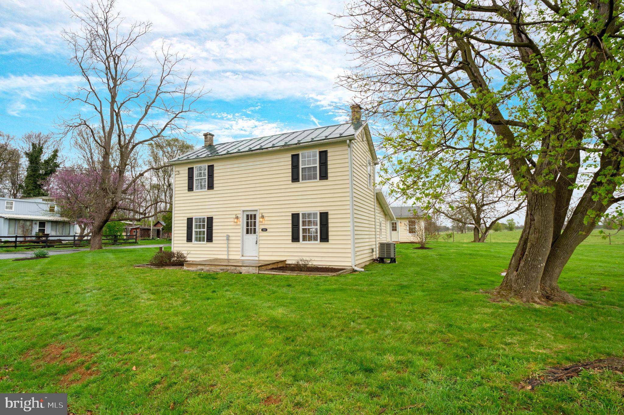 1080 Russell Road Berryville, VA 22611 - Photo 3 of 31 a white house that has a tree in front of it