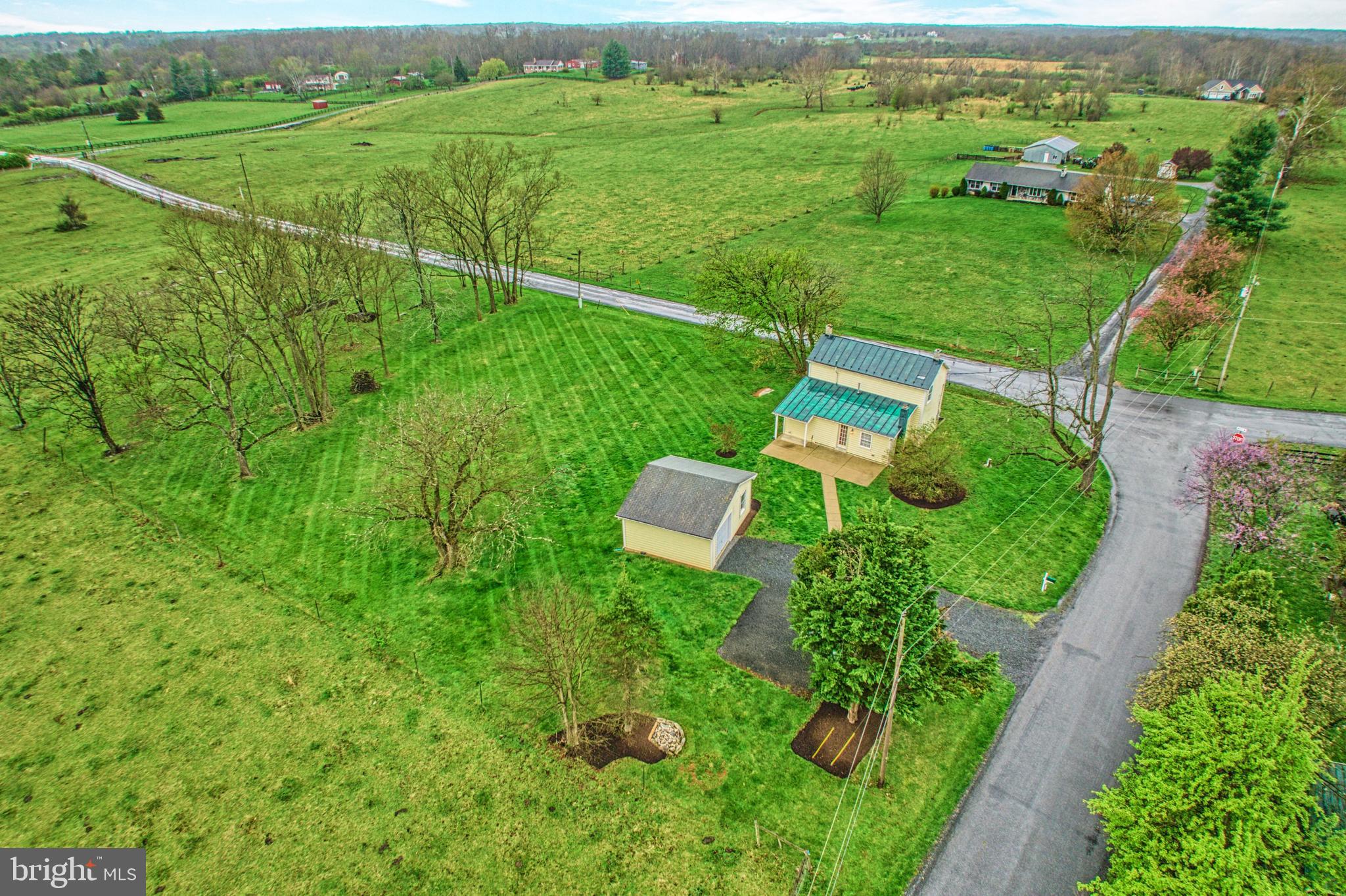 1080 Russell Road Berryville, VA 22611 - Photo 31 of 31 an aerial view of residential houses with outdoor space and trees