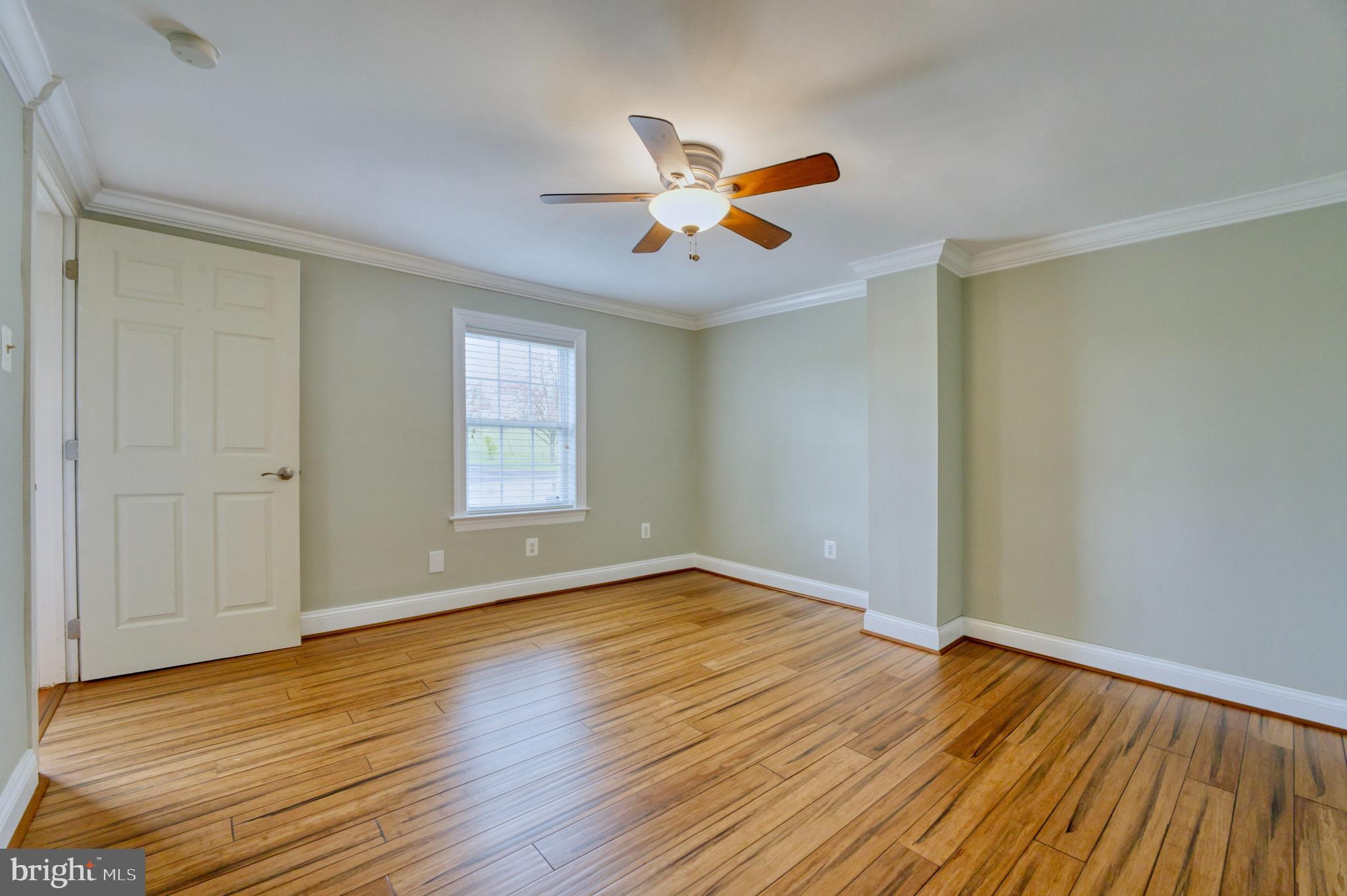 1080 Russell Road Berryville, VA 22611 - Photo 9 of 31 a view of empty room with wooden floor and fan