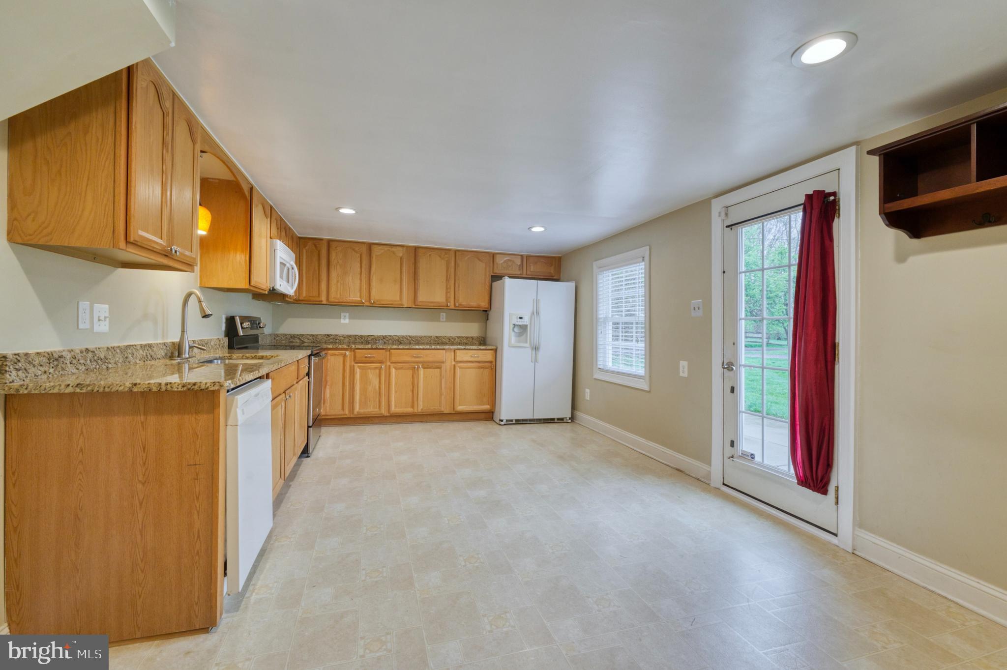 1080 Russell Road Berryville, VA 22611 - Photo 10 of 31 a view of a kitchen with a sink and cabinets