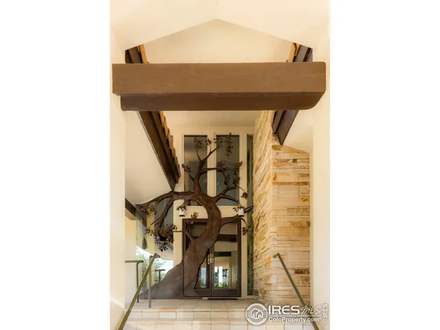 a balcony with a table and chairs