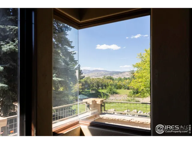 a bedroom with a bed and a mirror