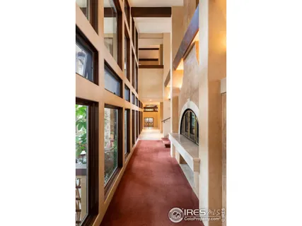 a balcony with a table and chairs