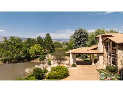 a view of a house with backyard sitting area and garden