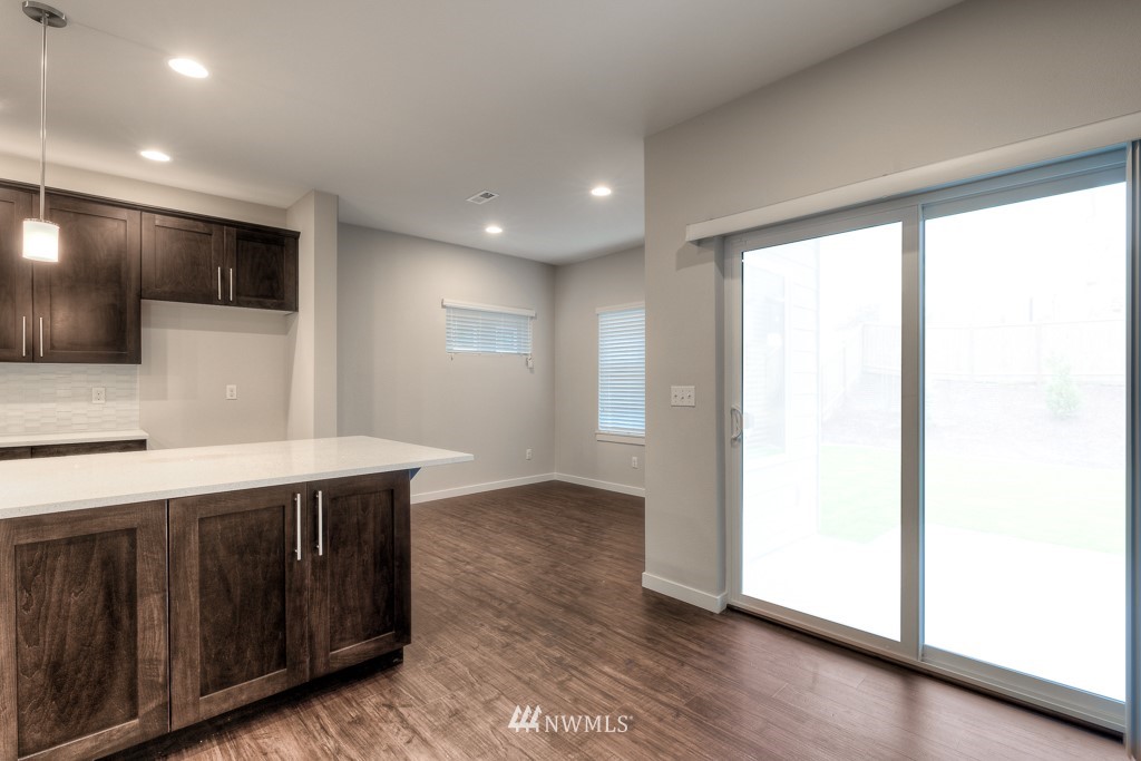 3944 242nd Street Southeast, Unit PT 8 Bothell, WA 98021 - Photo 5 of 23 a view of a kitchen with a sink and a large window