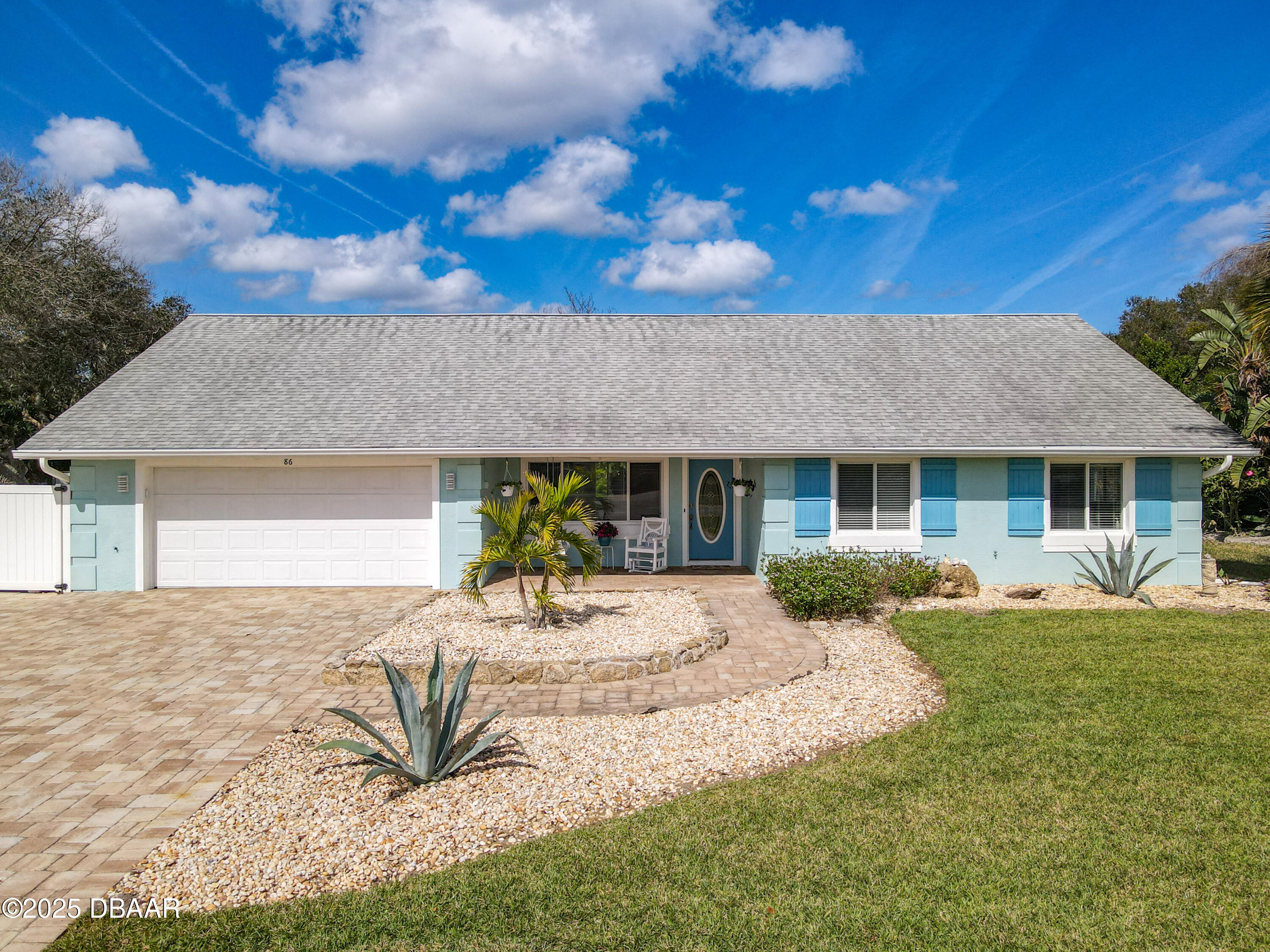 86 Rains Court Ponce Inlet, FL 32127 - Photo 1 of 71 a front view of a house with a yard and outdoor seating