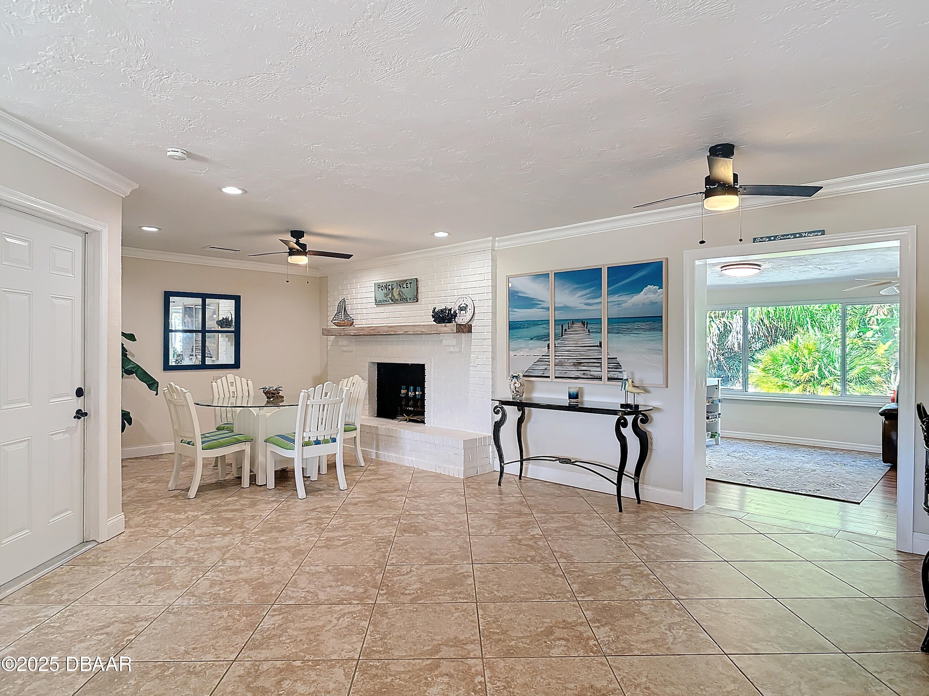 86 Rains Court Ponce Inlet, FL 32127 - Photo 11 of 71 a living room with furniture a fireplace and a table