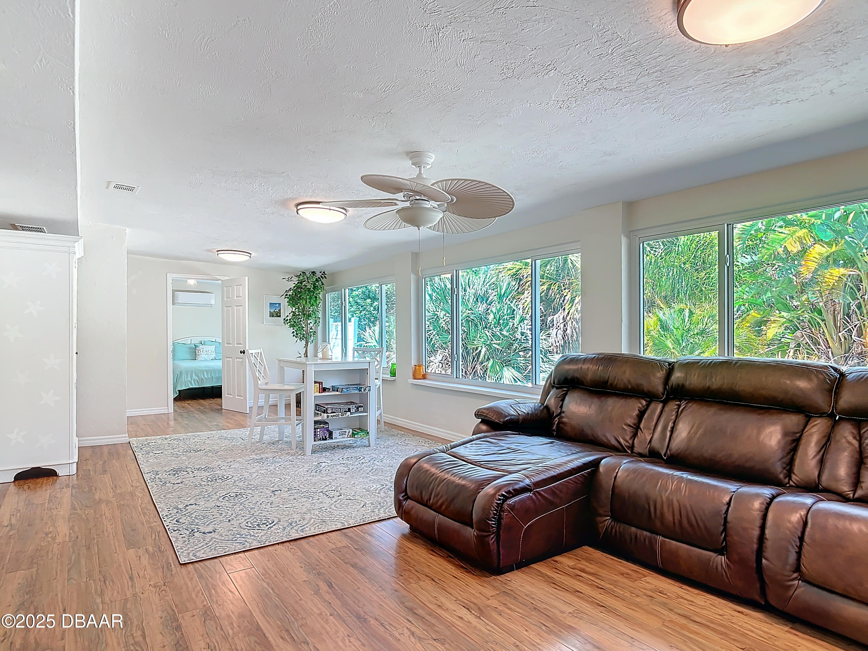 86 Rains Court Ponce Inlet, FL 32127 - Photo 27 of 71 a living room with furniture and a large window