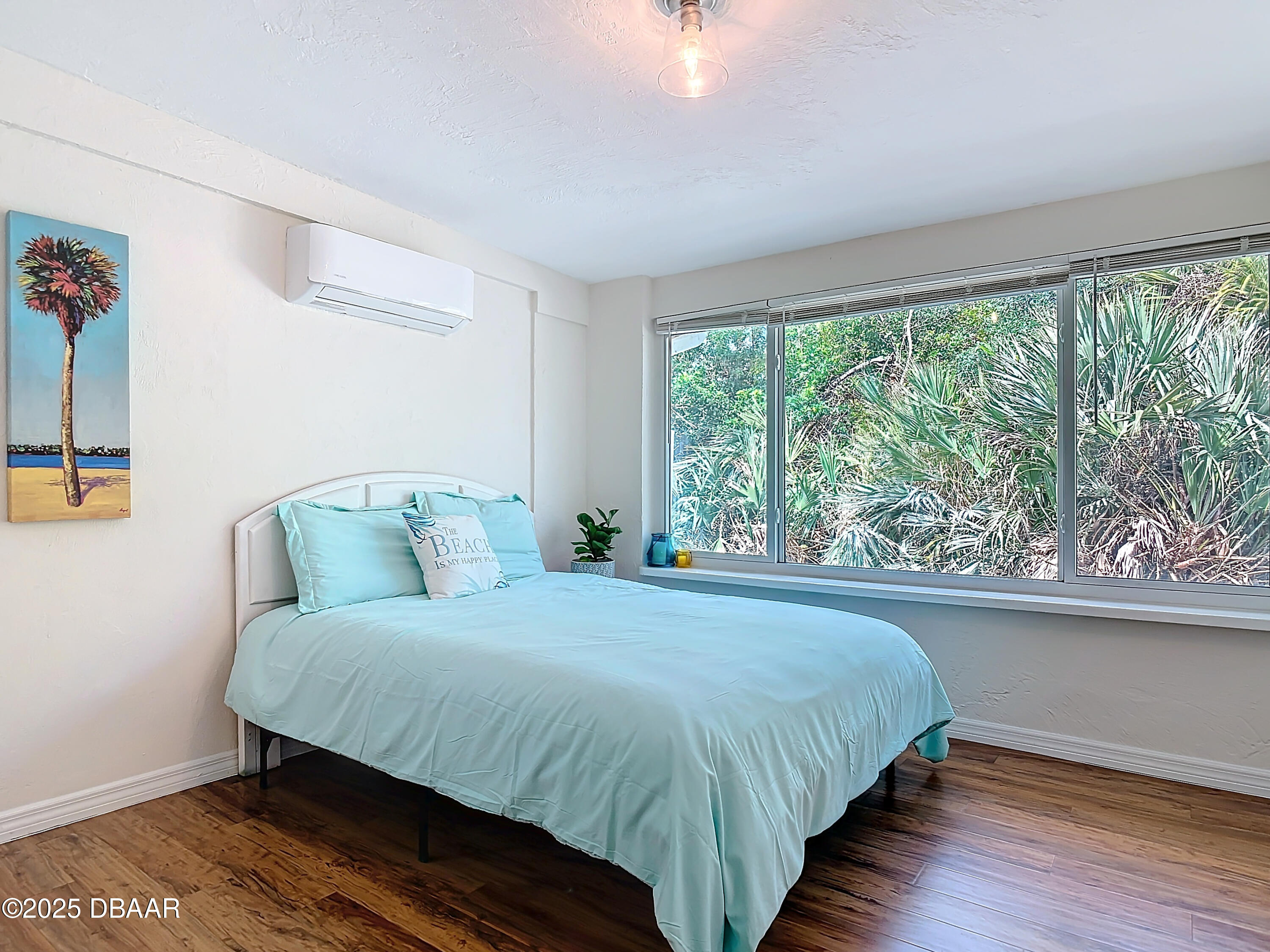 86 Rains Court Ponce Inlet, FL 32127 - Photo 29 of 71 a bedroom with a bed and window