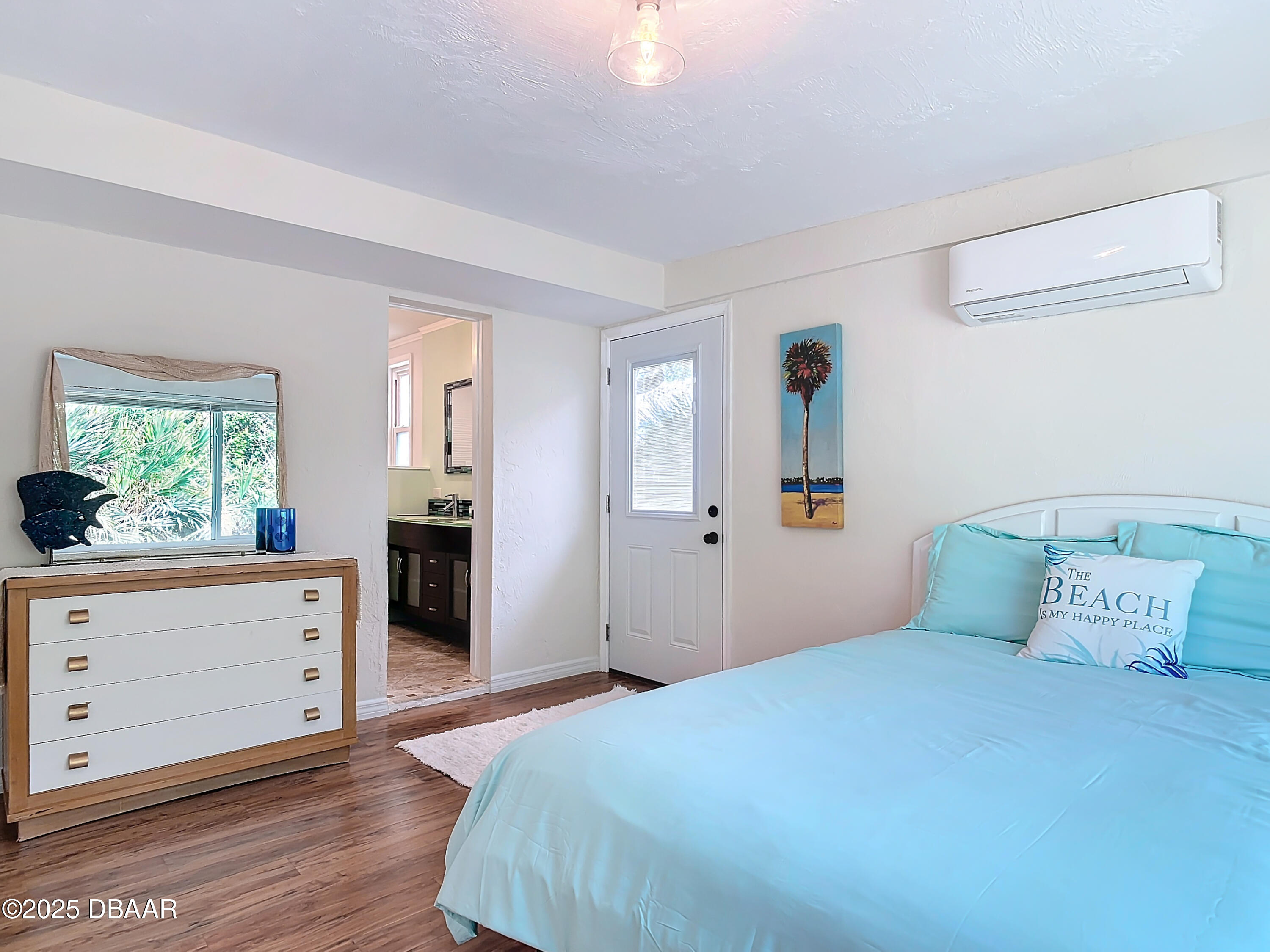 86 Rains Court Ponce Inlet, FL 32127 - Photo 30 of 71 a bedroom with a bed and a dresser