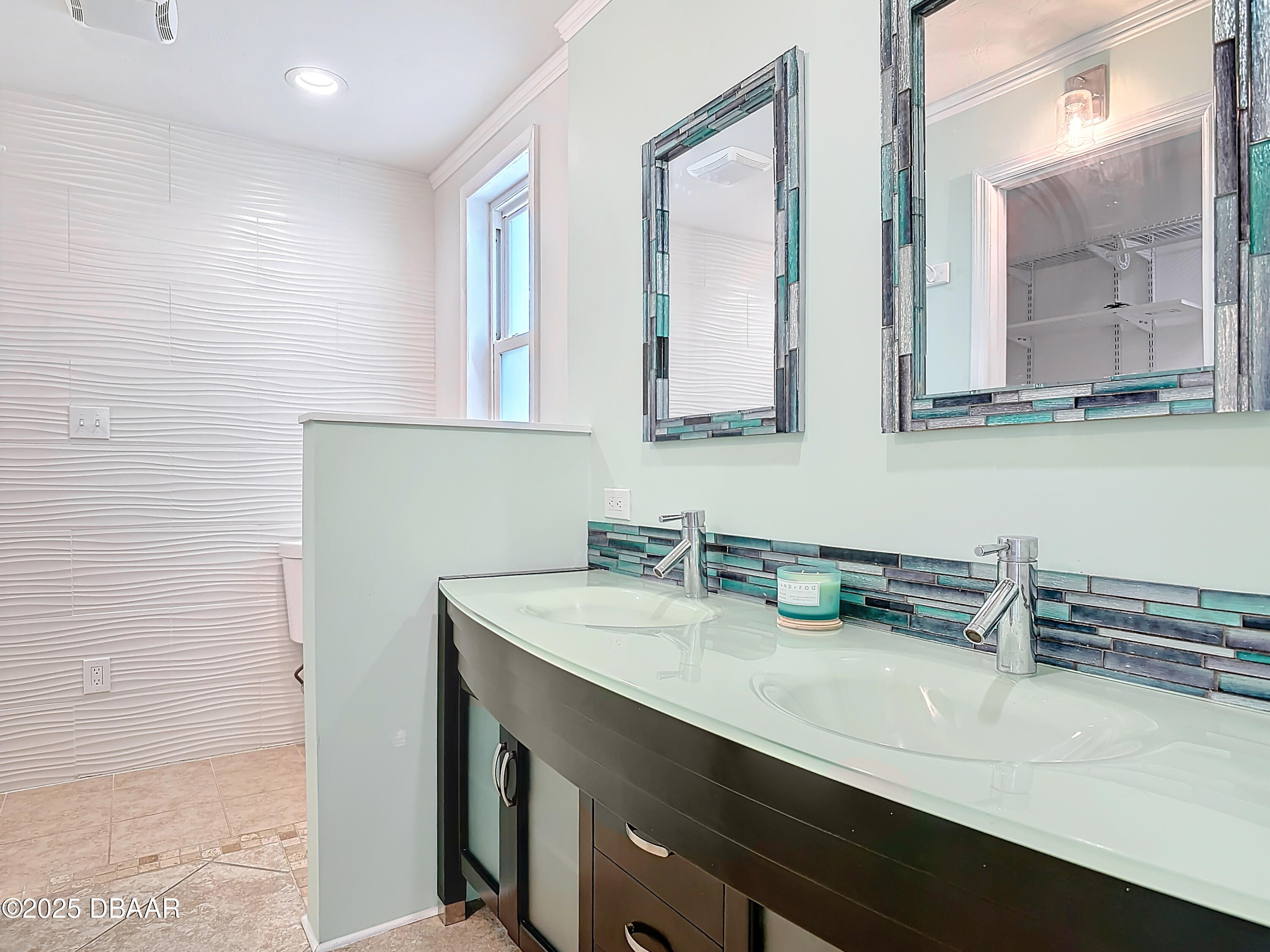 86 Rains Court Ponce Inlet, FL 32127 - Photo 32 of 71 a bathroom with a sink and a mirror