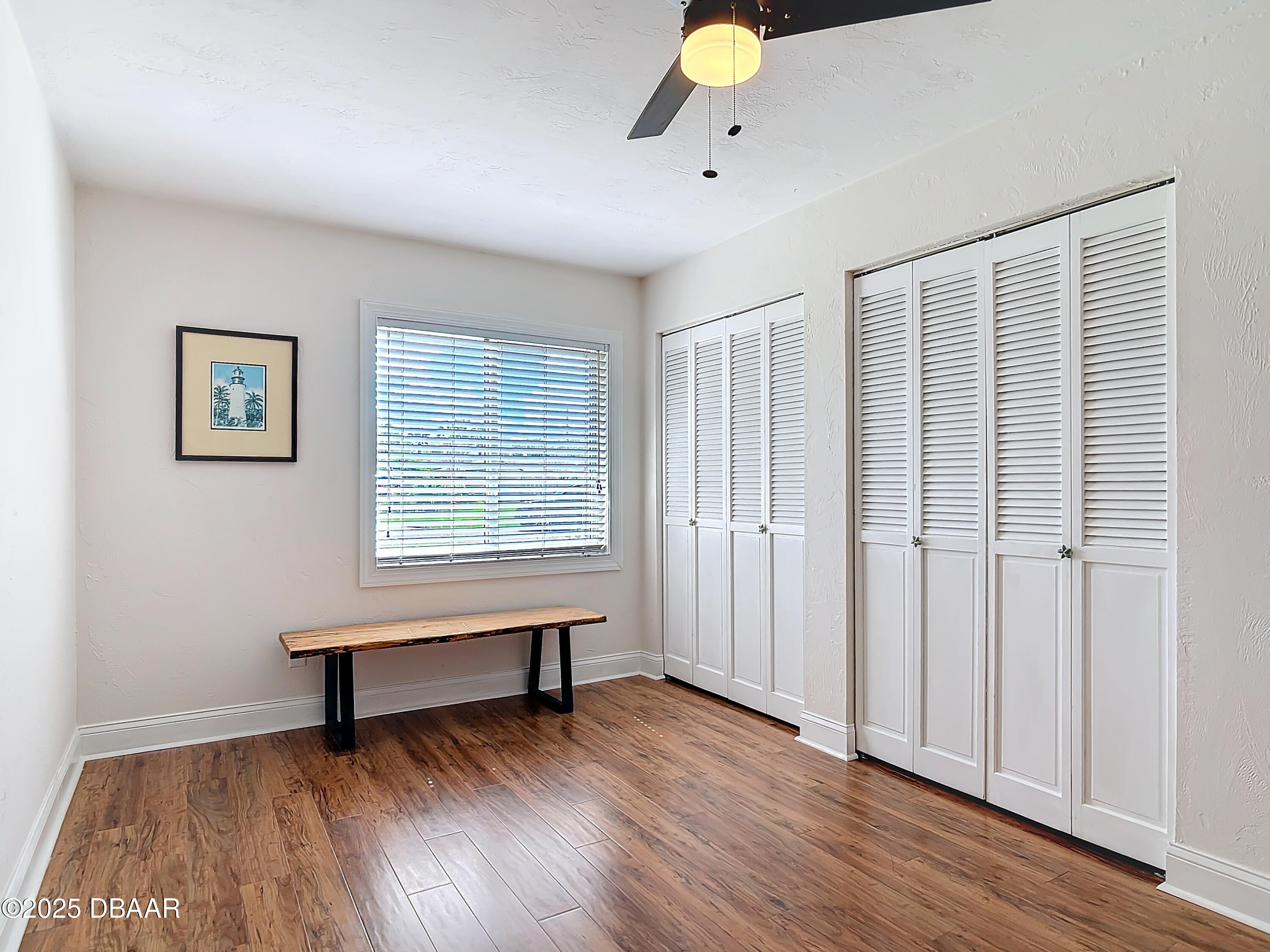 86 Rains Court Ponce Inlet, FL 32127 - Photo 37 of 71 a view of an empty room with wooden floor and a window