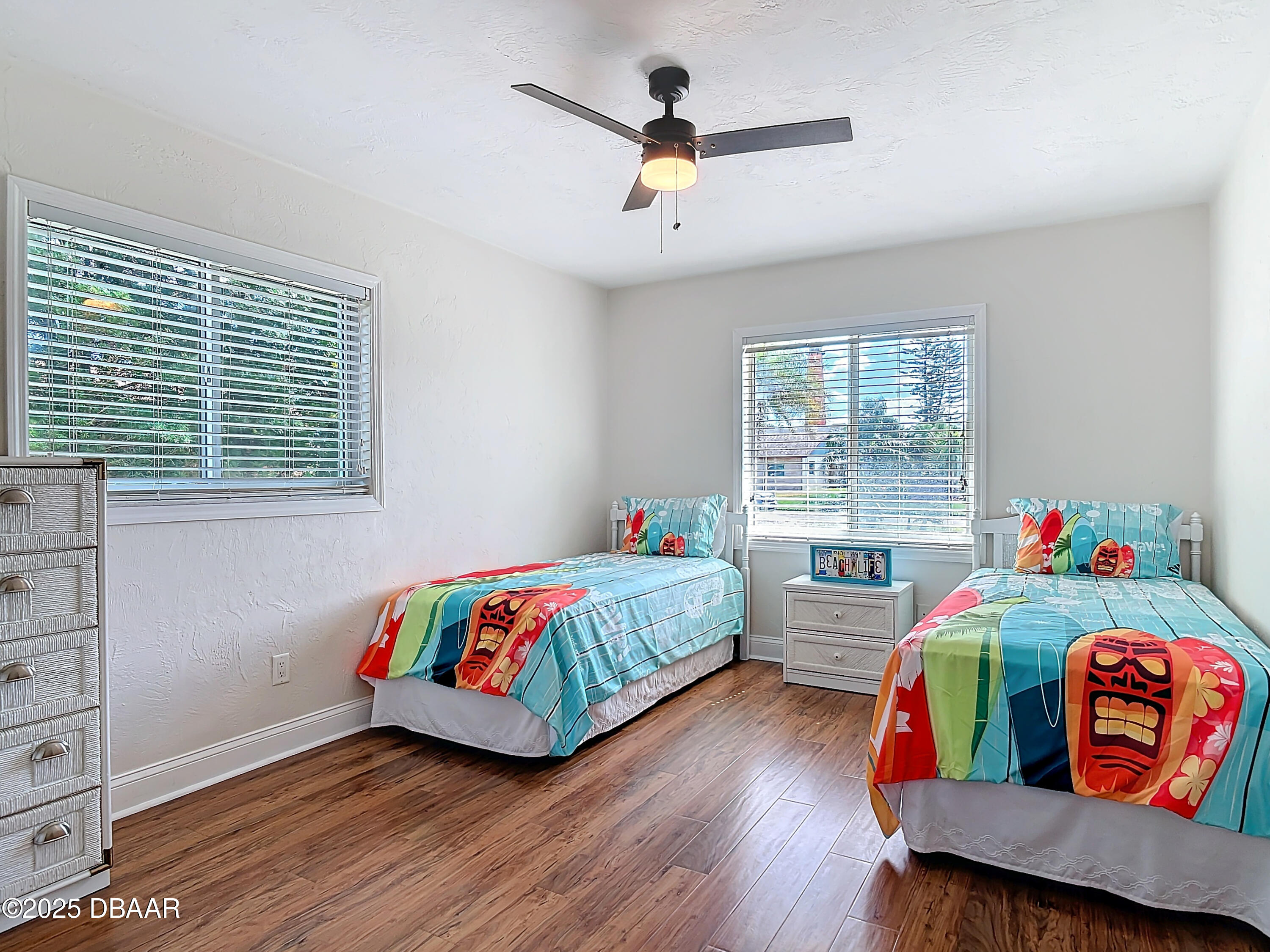 86 Rains Court Ponce Inlet, FL 32127 - Photo 42 of 71 a bedroom with two beds and a window