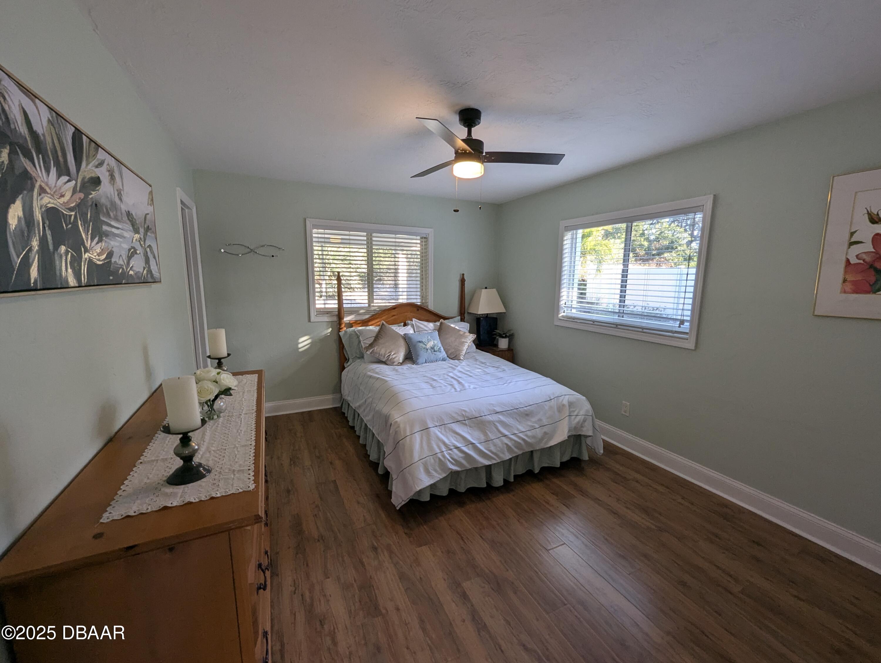 86 Rains Court Ponce Inlet, FL 32127 - Photo 43 of 71 a bedroom with a bed and wooden floor