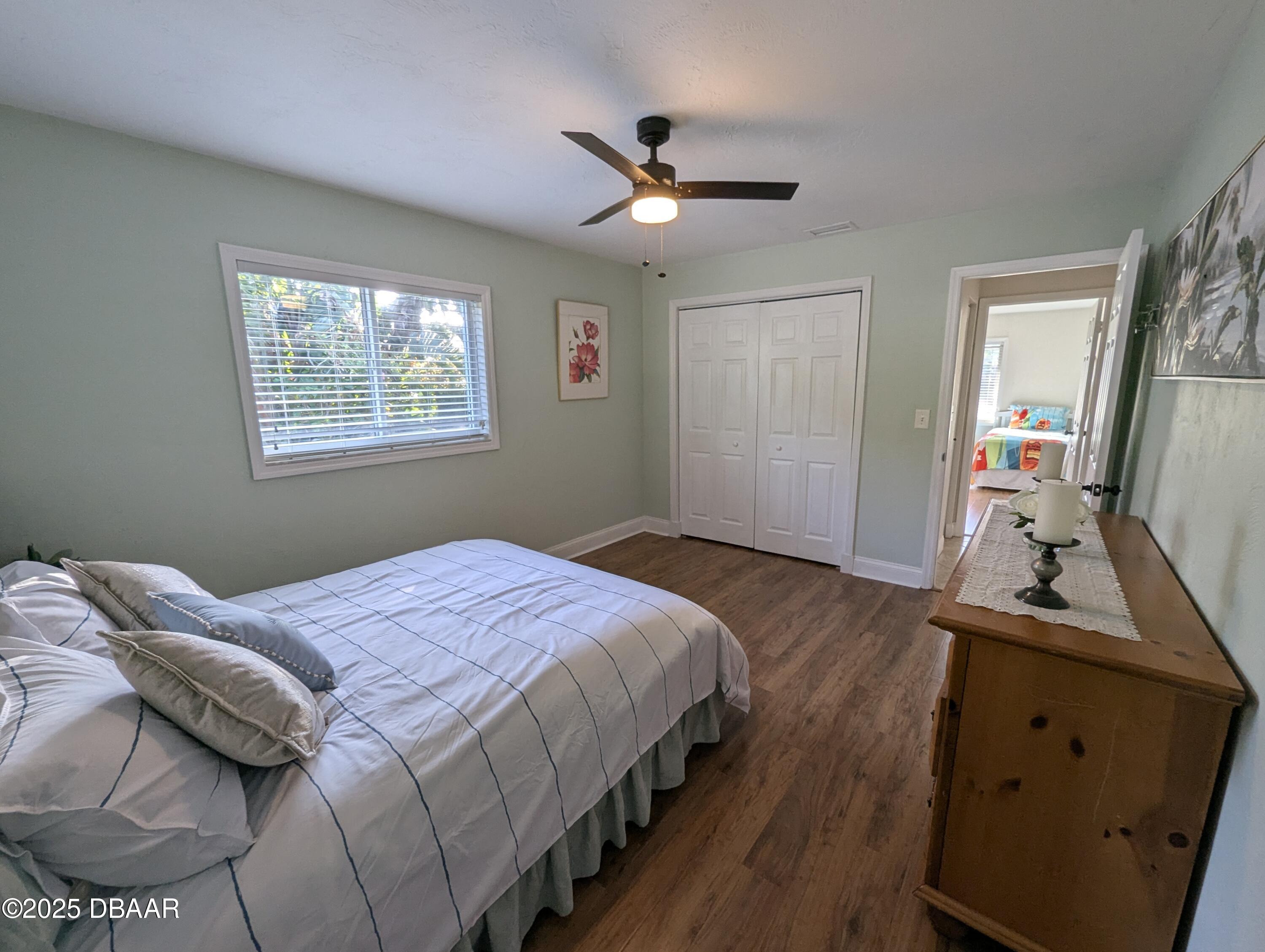 86 Rains Court Ponce Inlet, FL 32127 - Photo 45 of 71 a bedroom with a bed and a flat tv screen on dresser