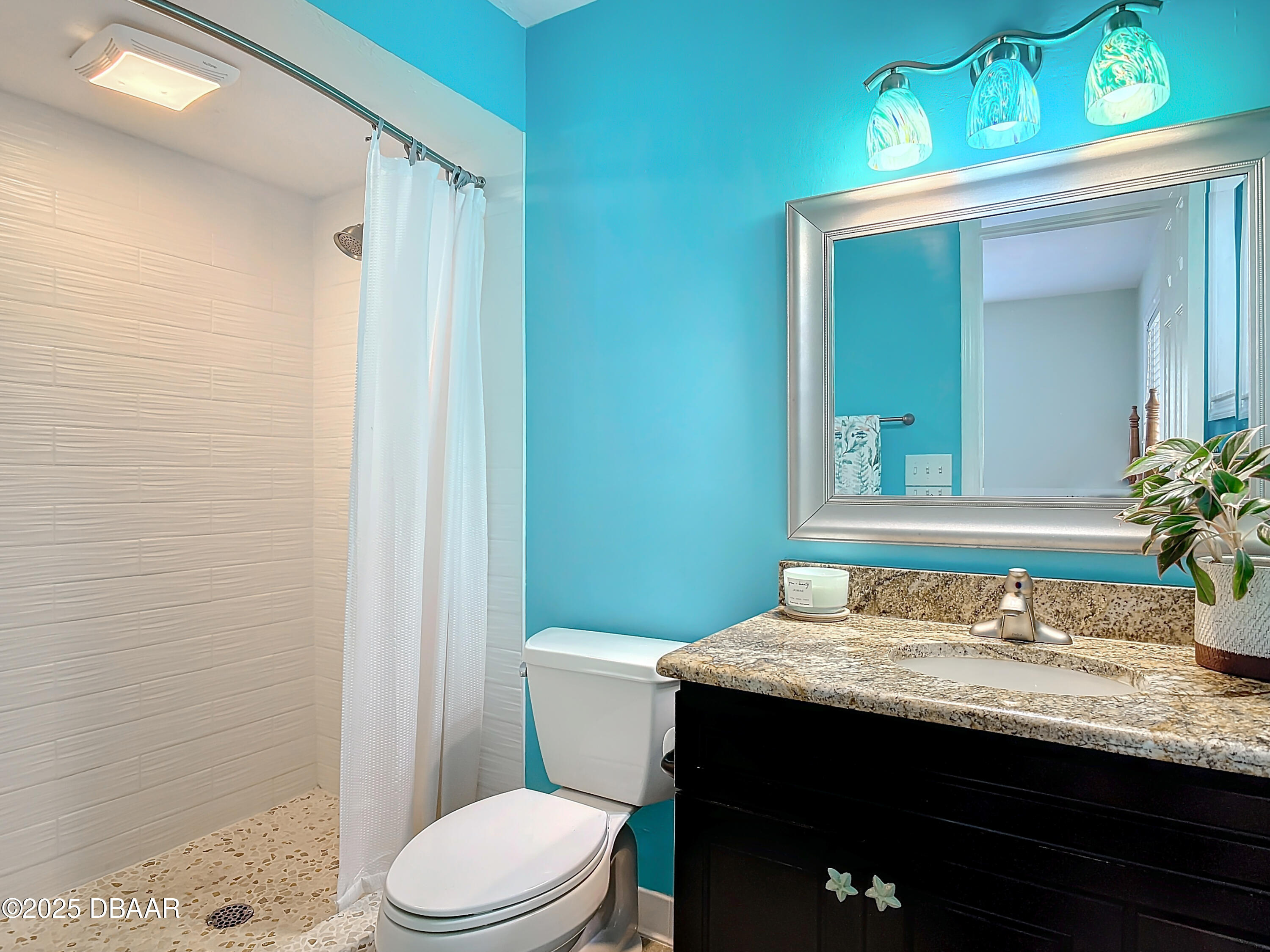 86 Rains Court Ponce Inlet, FL 32127 - Photo 47 of 71 a bathroom with a granite countertop sink toilet and shower