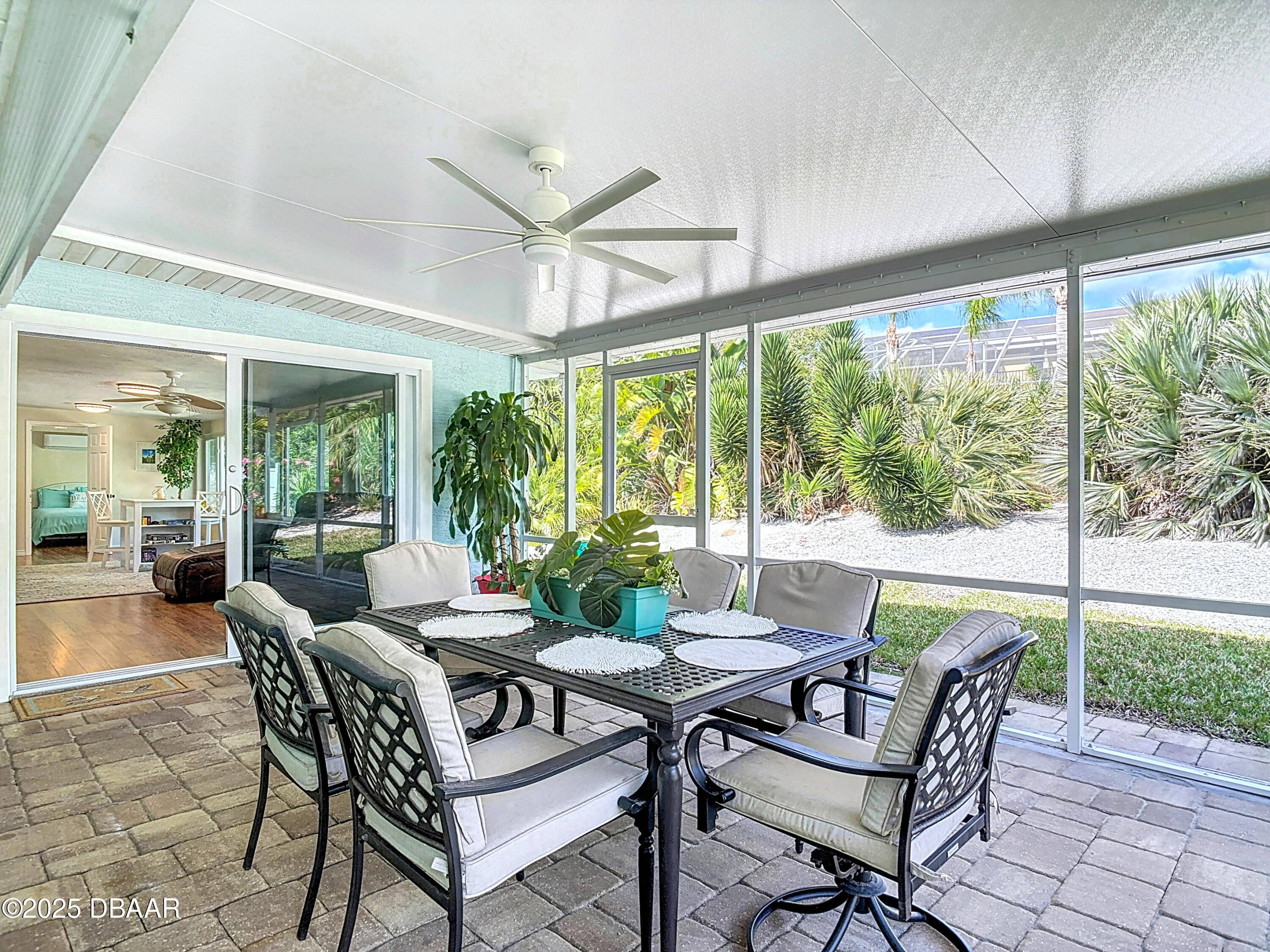 86 Rains Court Ponce Inlet, FL 32127 - Photo 51 of 71 a dining room with furniture large windows and garden view