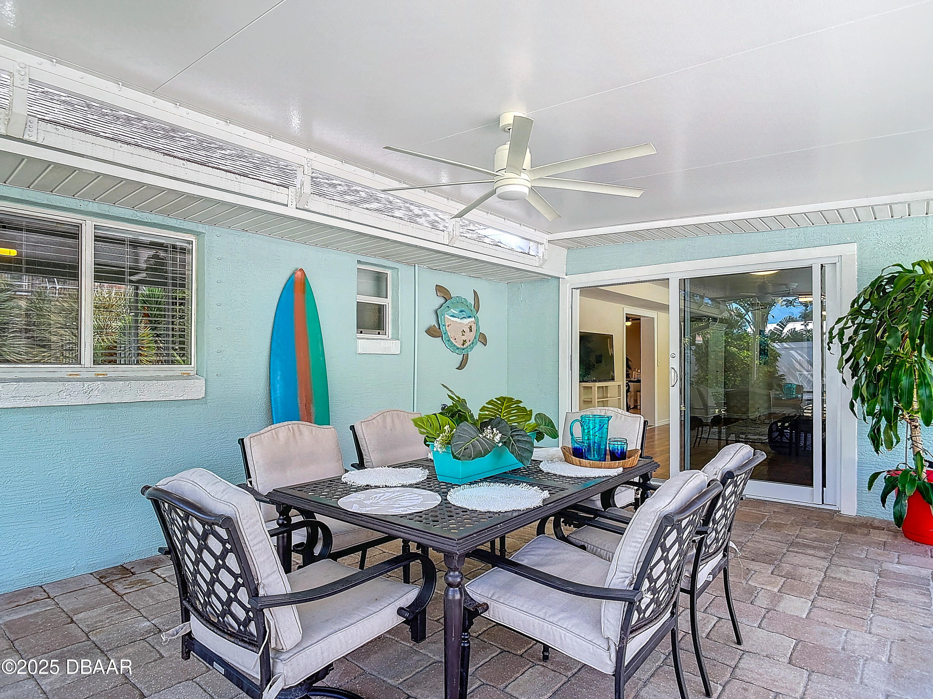 86 Rains Court Ponce Inlet, FL 32127 - Photo 52 of 71 a view of a dining room with furniture window and wooden floor