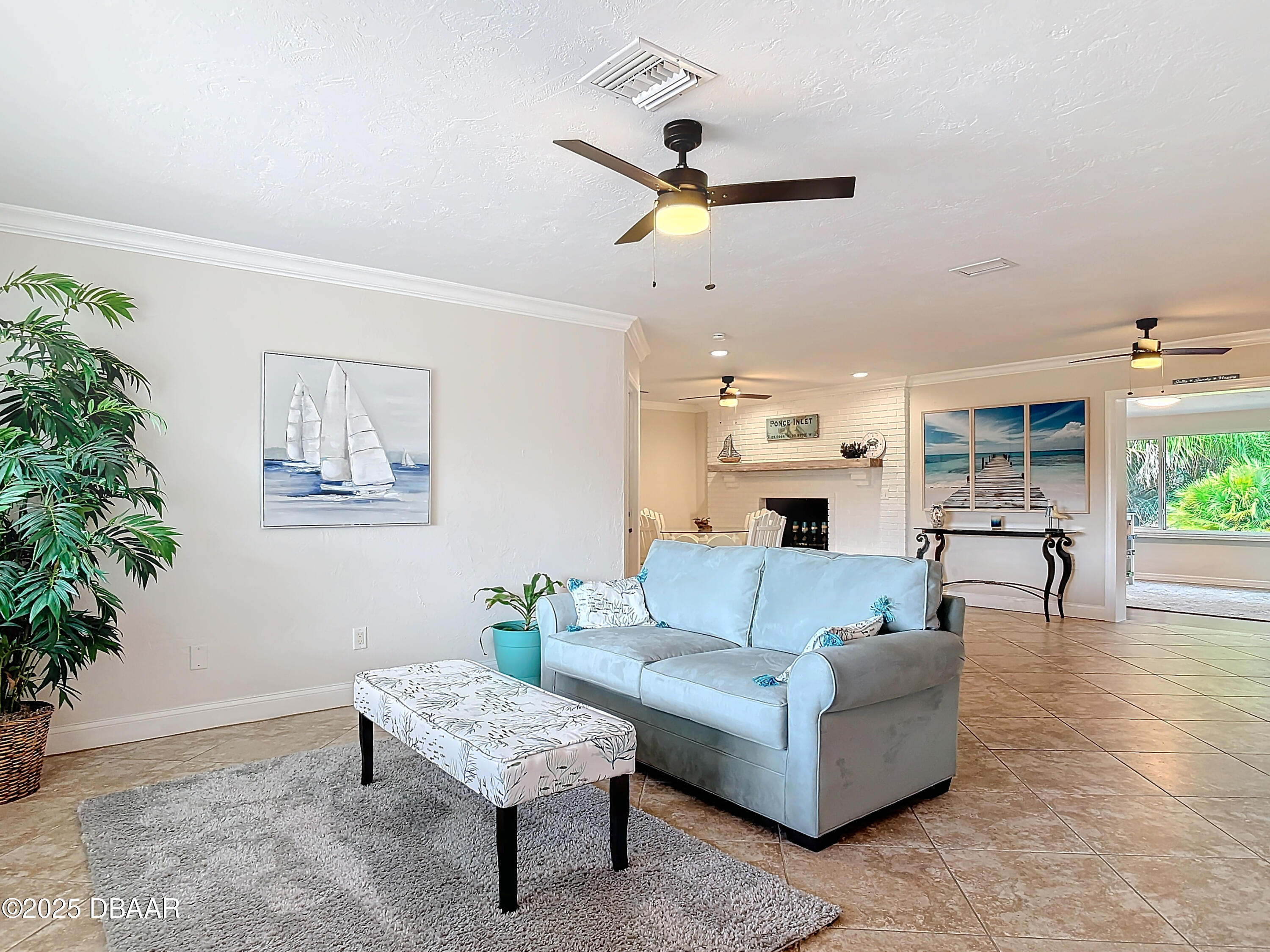 86 Rains Court Ponce Inlet, FL 32127 - Photo 7 of 71 a living room with furniture and a large window